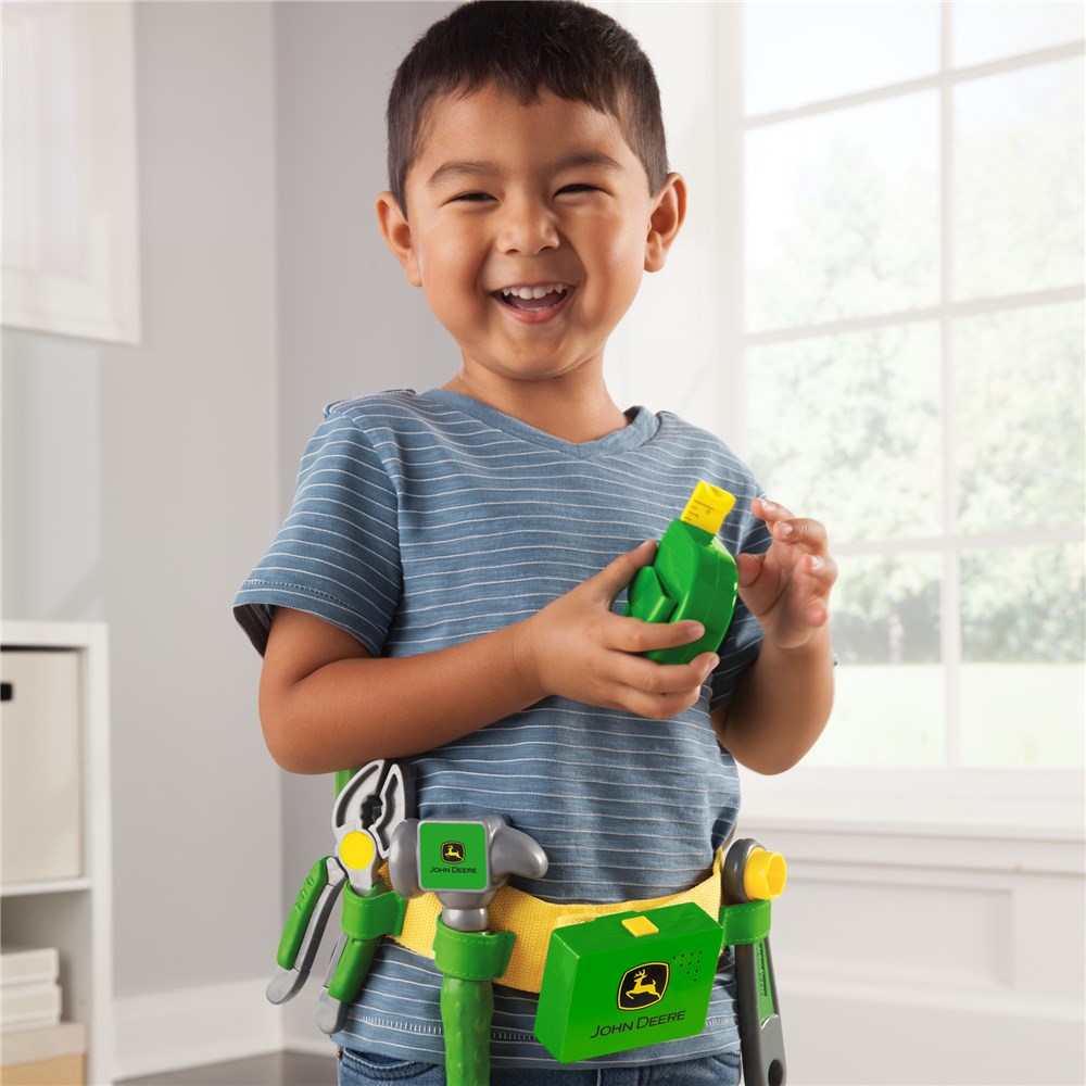Child wearing John Deere Talking Toolbelt Toy