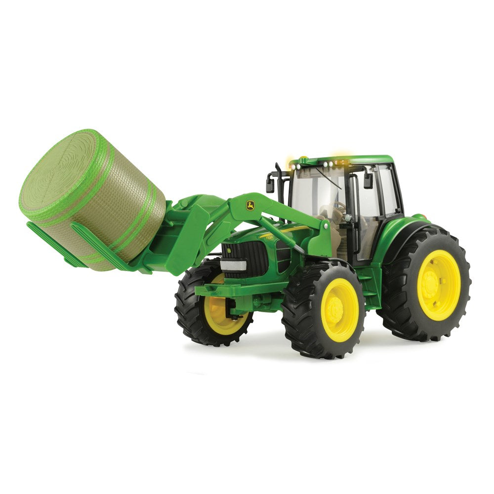 John Deere 7330 Tractor with Bale Mover and Round Bale