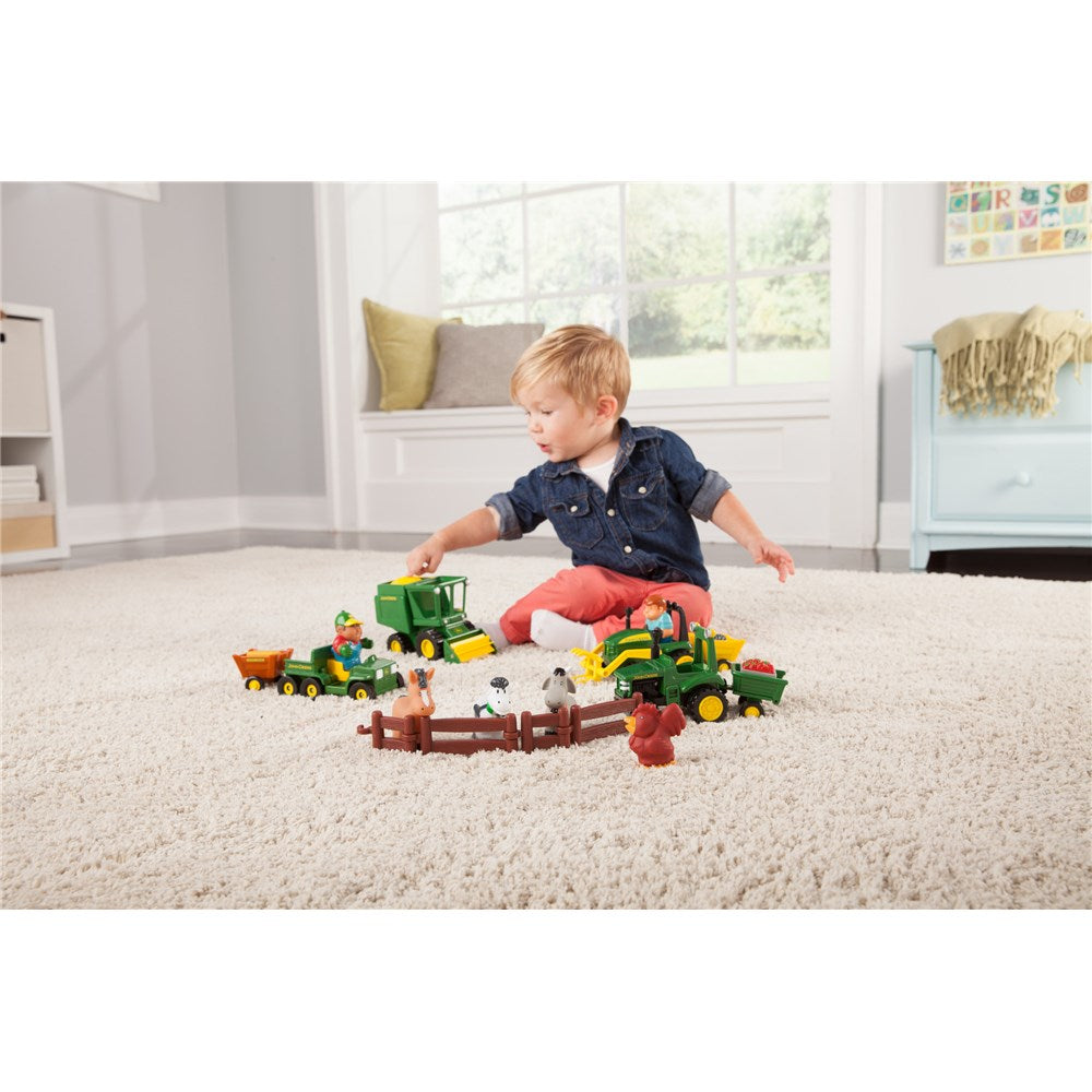 Child playing with John Deere Fun on the Farm Playset 