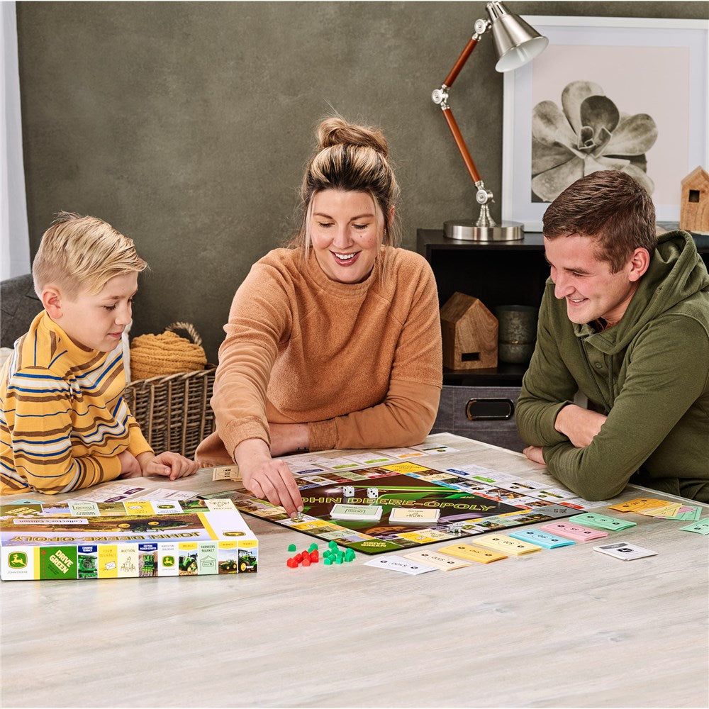 Family playing John Deere-opoly Game