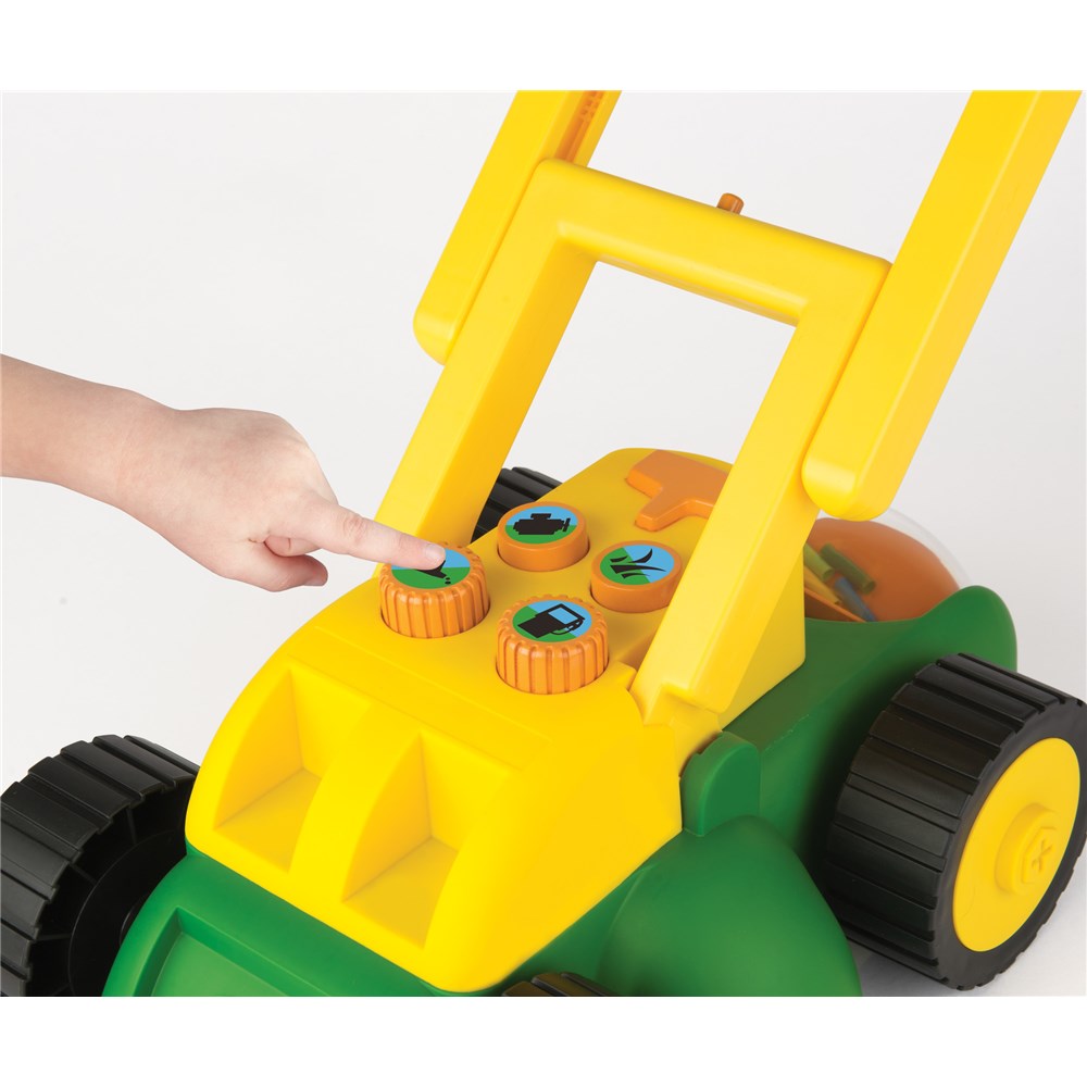 Demonstrating buttons on John Deere Toy Real Sounds Lawn Mower